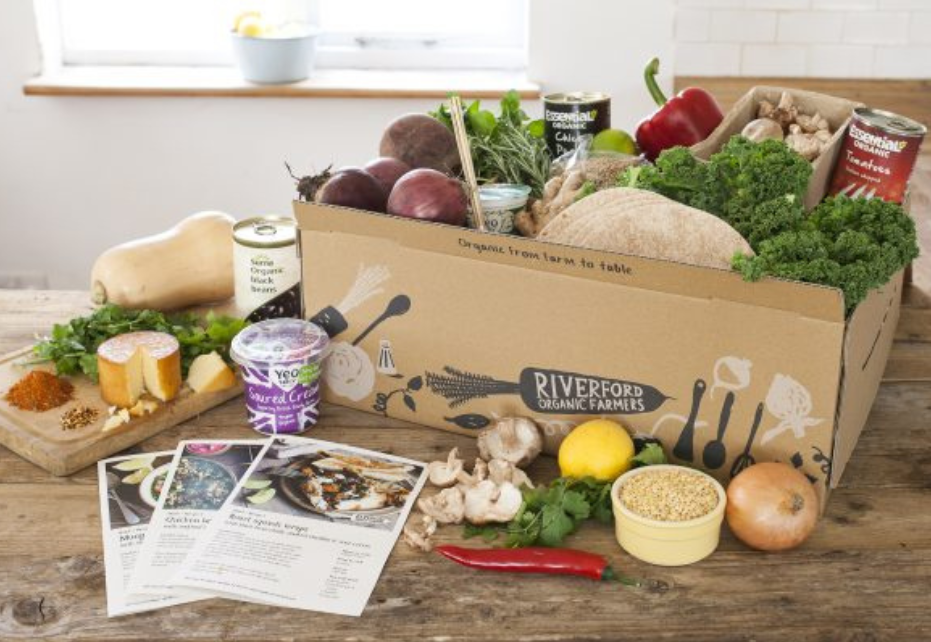 Riverford food boxes stacked