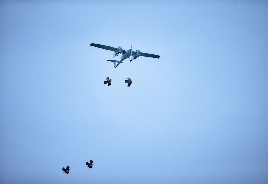 Smurfit Kappa pack being thrown from Wings for Aid plane